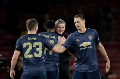 Ole Gunnar Solskjær kunne smile bedt etter Manchester Uniteds 3-1-seier borte mot Arsenal i FA-cupen.